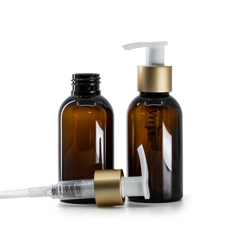 Hnědá plastová láhev, bílý dávkovač na krém s matným zlatým kroužkem, 100 ml